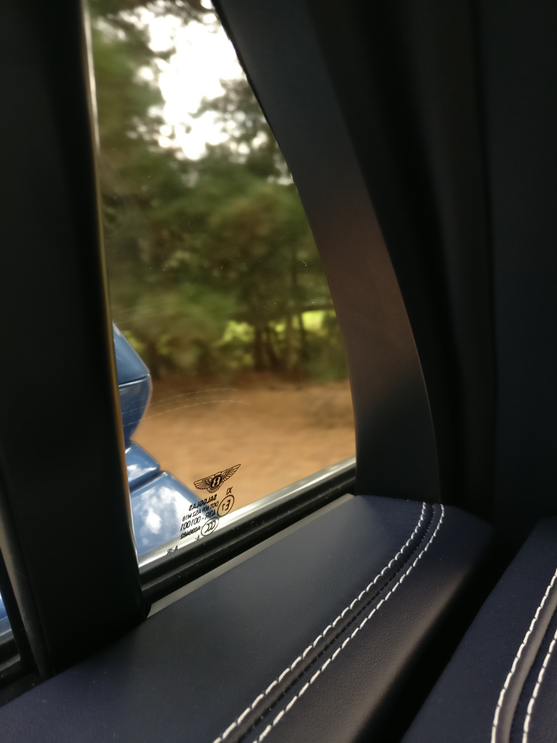 Bentley logos everywhere: seats, sills, headlights